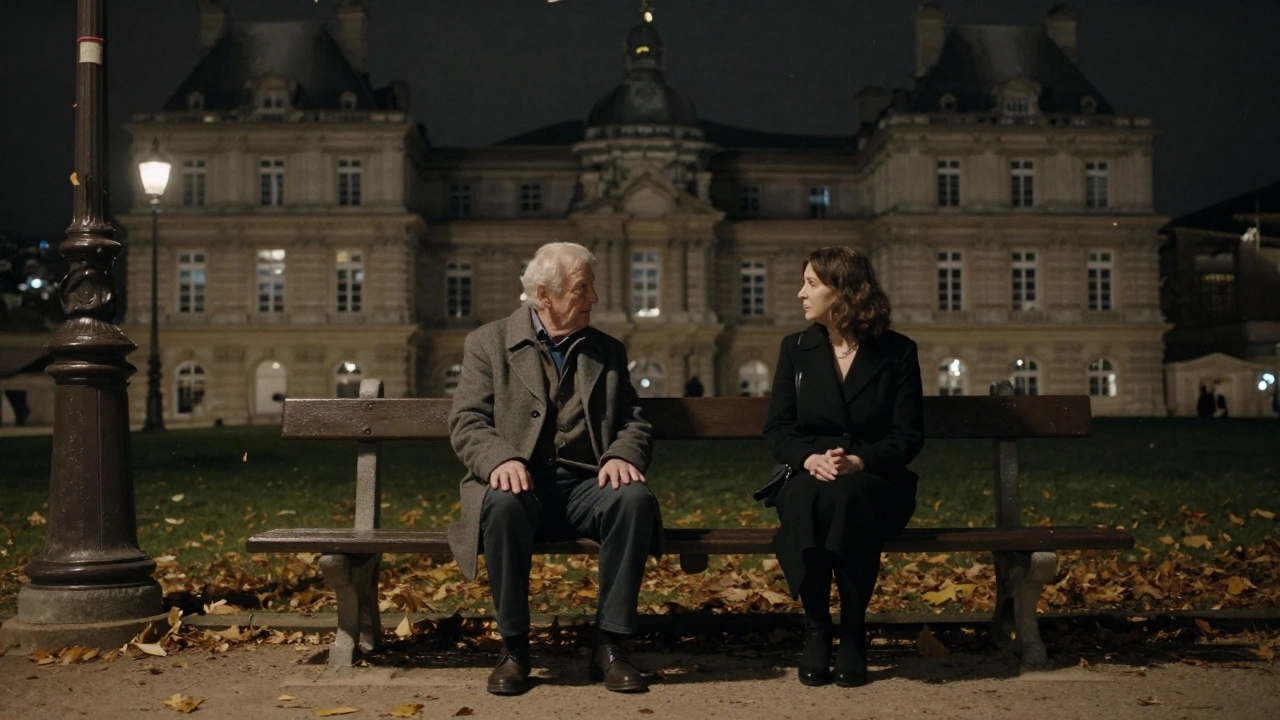 An elderly man and a woman talking calmly on a park bench in Luxembourg Gardens at dusk.